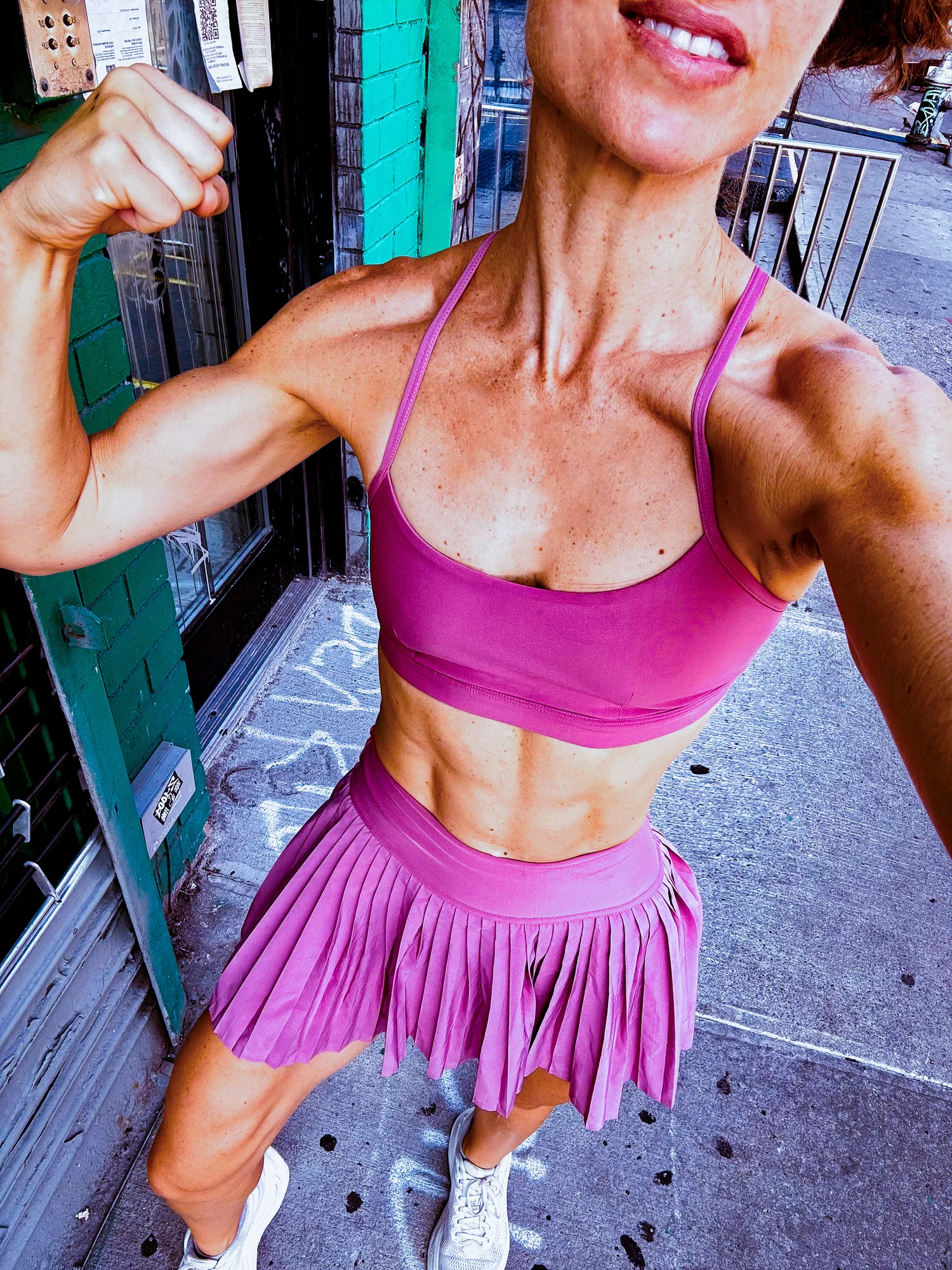 Playful athletic portrait in pink